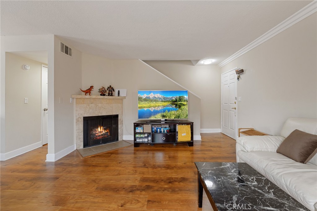 Welcome to 7045 Woodley Ave Unit 120, a well-appointed 3-bedroom, 2.5-bathroom townhome offering 1,216 square feet of comfortable living in the heart of Van Nuys’ sought-after Lake Balboa neighborhood. Tucked inside a gated community, this home offers a blend of convenience, practicality, and modern features. Step inside to find a bright and open living room filled with natural light, complete with a cozy fireplace that creates a warm and inviting atmosphere. The open-concept layout flows effortlessly into a modern kitchen equipped with stainless steel appliances and plenty of cabinet space—ideal for both everyday living and entertaining. A convenient half bath is located on the main floor for guests. Upstairs, you'll find three well-sized bedrooms, including a comfortable primary suite, along with two full bathrooms. Enjoy your own private balcony—perfect for sipping coffee, reading, or simply getting a bit of fresh air. The attached 2-car garage provides direct access and added storage, and there's also a guest parking pass for added convenience. Located in a prime area near Lake Balboa Park, popular shopping and dining options, and just minutes from the 101 and 405 freeways, this townhome also offers easy access to Van Nuys Airport and other local conveniences. If you're looking for a comfortable, move-in-ready home in a central location with practical amenities, this is a must-see opportunity.