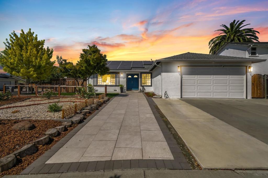 Just moments away from local schools and lush Meadows Park, this four-bedroom home is surrounded by spacious outdoor living. Admire the low-maintenance front yard before stepping inside through double doors that open into a sunny interior. To your right, a versatile room incorporates closets, making this a comfortable guest space, craft room, or bright home office. To the left of the entry, an oversized window allows natural light to cascade across the formal living room and attached dining area. Planked flooring extends to meet the tiled kitchen, where white shaker cabinetry and stainless steel appliances enhance every culinary experience. Recessed lighting and a towering skylight adorn the sloped ceiling in the more casual living room, and a glass slider opens to reveal the private backyard. Dine, entertain, or simply unwind in this desirable outdoor space. Inside, a hallway leads past two airy guest bedrooms, a sleek bathroom with a shower/tub combo, and into a lovely primary suite hidden behind double doors. Appreciate dual closets and an ensuite, adding even more convenience to this abode. An attached garage, laundry room, and backyard shed are just a few of the additional amenities that elevate this home.