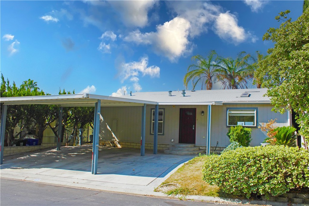 Welcome to this beautifully maintained 2 bedroom, 2 bathroom home located in one of Southern California's most prestigious 55+ communities. Positioned to capture sweeping views of the valley and sparkling city lights, this home offers both comfort and scenery.
Inside, you’ll find a spacious layout that includes a dedicated office just off the primary suite—complete with a separate entrance to the exterior, perfect for hobbies, reading, or remote work. The large kitchen is a true highlight, featuring an oversized island and ample counter space, ideal for cooking and entertaining. A cozy fireplace adds warmth to the inviting living area, while the separate laundry room adds everyday convenience.
Step outside to enjoy a thoughtfully landscaped backyard with a covered patio—perfect for relaxing evenings or morning coffee with a view. The wide, side-by-side carport provides plenty of covered parking and easy access to the home.
Don’t miss this rare opportunity to own a home on a premium lot with incredible views in a vibrant, well-kept community.