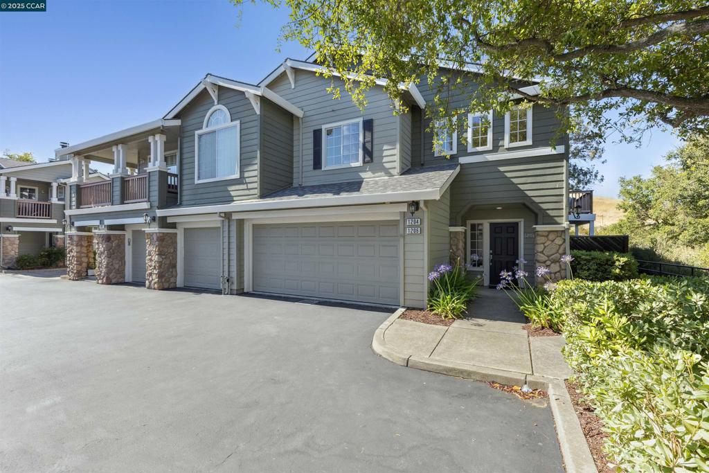 Experience elevated living at 1204 Destiny Lane, in the California Sunridge HOA. Set in one of the most desirable spots in the community, this sought after end unit offers a rare combination of privacy, comfort, and style. Tastefully updated throughout, this San Ramon home delivers both modern appeal & everyday livability. Featuring 3 spacious bedrooms & 2.5 baths, the residence is filled with natural light & showcases a thoughtfully designed, 1,325 square foot floor plan. This home has been recently refreshed, enhanced by fresh paint, new carpeting, hardwood flooring, and designer light fixtures throughout. The open concept kitchen is both elegant & functional, with stone countertops & plenty of space for entertaining guests or enjoying a peaceful night in. A cozy wood burning fireplace anchors the living area, adding warmth and charm. Step onto your primary bedroom’s private balcony to enjoy sweeping views of the Las Trampas Foothills, ideal for morning coffee or evening relaxation. Additional highlights include a spacious two-car garage, ample storage, and a prime location w/in the highly rated San Ramon Valley Unified School District. An extra bonus is the the community pool and spa with plenty of space to relax and lounge while enjoying the wonderful weather.