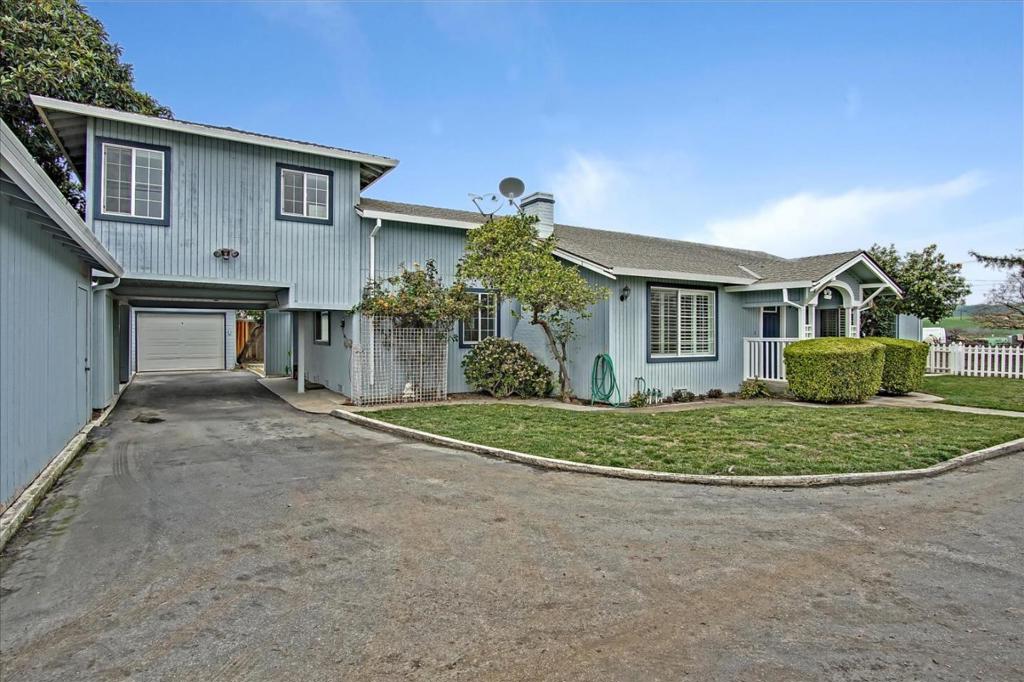 Awesome investment property with rental units or multi generational families. This once in a lifetime property, has 10 acres of row crops with the main home featuring four bedrooms/3 bathrooms, w/ an additional suite located upstairs. Completely remodeled in (2013 with stunning hardwoods floors, shutters, and updated kitchen w/ granite counters which open to a sunny dining room/eating area. Jack and Jill Bathroom connect both bedrooms. Adorable backyard with a fireplace and a walk in storage shed. Guest house, mobile home and storage building have long term tenants. Small guest home is an updated 687 square feet, one bedroom, one bathroom. Enjoy entertaining in a 822 sq feet game room located right off the patio. Two large structures, Barn & 5000 square feet, former packing house on property to house farm equipment or even rent out. Barn is vacant and can be used. Private well. Endless views of mountains and serenity. Wired for security system.
