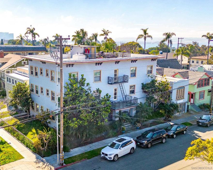 Pleased to present The Catalina located at 237 Spruce Street in San Diego, California. The 14-unit apartment complex is located in the highly desirable neighborhood of Bankers Hill and boasts a Walk Score of 85. Originally built in 1913 and renovated in 2005, the property sits on a 5,171 square foot lot and the building measures approximately 8,724 square feet.  The unit mix consists of (1) two bedroom / one bathroom unit, (12) junior one bed / one bath units, and a newly constructed studio. All junior one bedroom units have pocket doors separating the bedroom area from the living room and are significantly larger than typical units from this vintage. The property has been meticulously well-maintained with various capital improvements completed by current ownership. The exterior of the property has been updated with dual pane vinyl windows, fresh paint, and a fully rebuilt fire escape on the north side of the building. Both the electrical system and drain lines have been upgraded, as well as a newly upgraded sewer line with an epoxy liner.  Attractive tenant offerings include secure gated entry, on-site laundry, and a third floor rooftop deck with expansive views of the San Diego Bay. Electricity is separately metered reducing operating costs to the owner. Through a more extensive interior renovation, an investor can bring current rents to market and maximize overall cash flow.  Located only two blocks from Fifth Avenue and three blocks from Balboa Park (which also hosts the San Diego Zoo), the property is centrally located to all the best both Bankers Hill and Hillcrest.