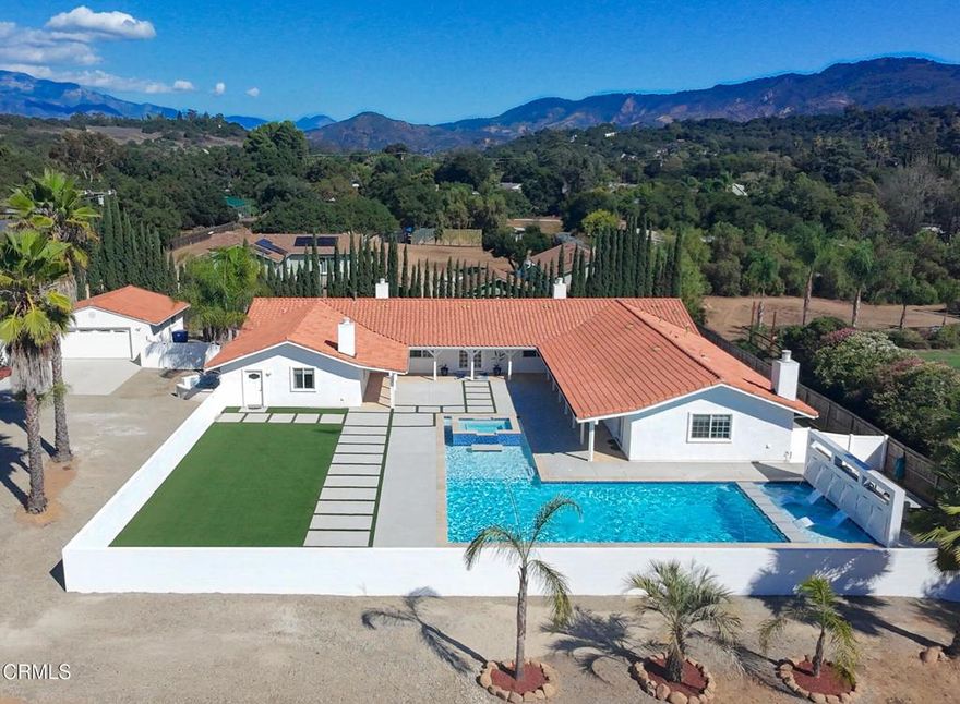 Priced to Sell -- Expansive Ojai Compound with Guest House, Private Bungalows, Resort-Style Pool, and Orchard Discover a rare multi-structure compound in the heart of Ojai -- ideal for multi-generational or multi-family living, creative retreats, or hosting -- set on 1.4 peaceful, flexible acres. This estate blends spacious interiors with thoughtfully designed outdoor amenities to support a wide range of lifestyles. Main House: 6 bedrooms and 6 full bathrooms, with an open floor plan and high ceilings that enhance natural light and encourage effortless indoor-outdoor living. Multiple sets of double French doors open to the central courtyard, where a sparkling resort-style pool and spa with waterfalls create a secluded oasis visible from much of the home. An attached studio-style mother-in-law suite includes a private entrance, providing separation from the main home -- ideal for downtime, guests, or unique household needs. A modern concrete ramp located at the rear of the home provides discreet accessibility while maintaining a clean aesthetic. Guest House: A multi-room guest house with its own gated street entrance for direct access. The light-filled layout includes an open kitchen, dining nook, and living area, ideal for everyday comfort or longer stays. A large fenced yard with low-maintenance turf, exterior-entry laundry, and mini-split climate control completes this private retreat. Private Bungalows: Two detached casita-style bungalows, each with mini-split systems and privately fenced outdoor spaces. Perfect for home offices, studios, or peaceful retreats. These flexible spaces suit extended family, guests, or even a corporate getaway. Resort-Style Pool & Spa: A stunning focal point of the main house, the courtyard features a 40-foot pool, twin Baja shelves with LED bubblers, six cascading waterfalls, a dramatic 20-foot fire feature, oversized spa, new turf, and a glow-in-the-dark pathway enclosed by a 5-foot privacy wall. Orchard & Land: An orchard of mature avocado and fruit trees enhances the grounds, alongside centrally located open land with equestrian or garden potential -- ready to adapt to your vision. This is more than a home -- it's a private Ojai retreat blending beauty, privacy, and possibility.Information provided as a courtesy, but not guaranteed. Listing Agent related to Seller.