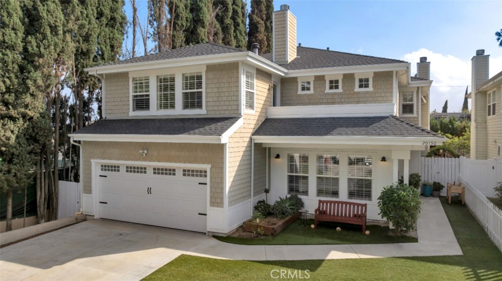 Nestled on a quiet, residential cul-de-sac in Winnetka, this beautifully maintained 5-bedroom, 4-bath residence offers nearly 3,300 sq ft of sophisticated living space, blending timeless design with modern amenities and peek-a-boo mountain views. Set behind a white picket fence, with drought conscious turf lawn, the home creates irresistible curb appeal. High-end, thoughtful touches throughout like hardwood floors, recessed lighting, dual pane windows, plantation shutters, and more! Step inside to a grand living room with soaring two-story ceilings, clerestory windows, and a fireplace that sets a warm tone for elegant entertaining. The adjoining formal dining room features decorative wainscotting and a built-in bar area. The space flows effortlessly into a chef’s dream of a kitchen, designed for both style and function, showcasing white shaker cabinetry, rich granite countertops, stainless steel appliances including a 5-burner gas range, and an expansive butcher-block island. The kitchen is open to a large, informal, living room with decorative beadboard wainscotting, custom built-ins, and glass doors out to the patio, that could be utilized as a great room with both informal living and dining. There is one bedroom downstairs with nearby ¾ hall bath that offers flexibility and privacy for guests or a home office. Upstairs, a generous loft/landing overlooks the living room below and offers additional space to be used as a casual den, a play area, or more. The primary suite is a calm retreat featuring a cozy gas fireplace, dual walk-in closets, and a private balcony. Its luxurious ensuite bath boasts marble tile floors, dual sinks, a soaking tub, separate walk-in shower, and bidet. A generous secondary suite has its own full en-suite bath. Two additional bedrooms, one set up as an office with built-in desk and Murphy bed, share a full hall bath with dual sinks. Additional features include convenient upstairs laundry facilities, dual zone AC, remote locking capabilities, Tesla charger, and solar! Outdoors, enjoy an entertainer’s backyard, perfect for entertaining or just enjoying a family cookout, with large slate patio, a built-in kitchen/BBQ area with gas hookup and sink, raised planters, and gravel pathways. A perfect blend of warmth, refinement, and smart design making it a opportunity not to be missed! Make this your next home!