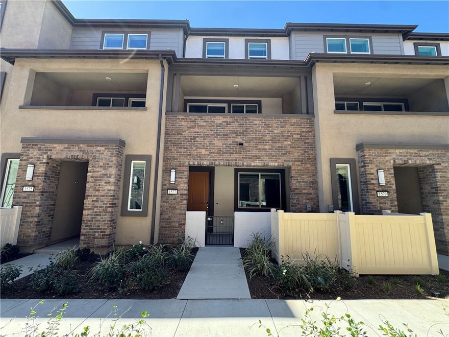 Discover this brand-new, three-story townhouse built by Meritage Homes, nestled in the vibrant Stratus community of Pomona. This modern residence features a dining /living room, 3 spacious bedrooms, 3 full bathrooms, a powder room, an inviting open-concept kitchen, and a family room that seamlessly extends to a generous second-floor balcony, perfect for relaxing or entertaining. One of the three bedrooms is located on the first floor, while the other two bedrooms are located on the third floor. Each bedroom has its own private bathroom. The home also features a 2-car bay garage and is equipped with a fully paid-off 3.24 kW 8-panel solar system, as well as a washer, dryer, and refrigerator for added convenience. The community enhances your lifestyle with amenities including a sparkling swimming pool, a recreation area with open turf, and barbecue facilities. Located just south of the 10 freeway and east of N. Dudley St., this townhouse offers an incredibly convenient location, placing you close to schools, colleges, universities, parks, airports, and downtown Los Angeles.