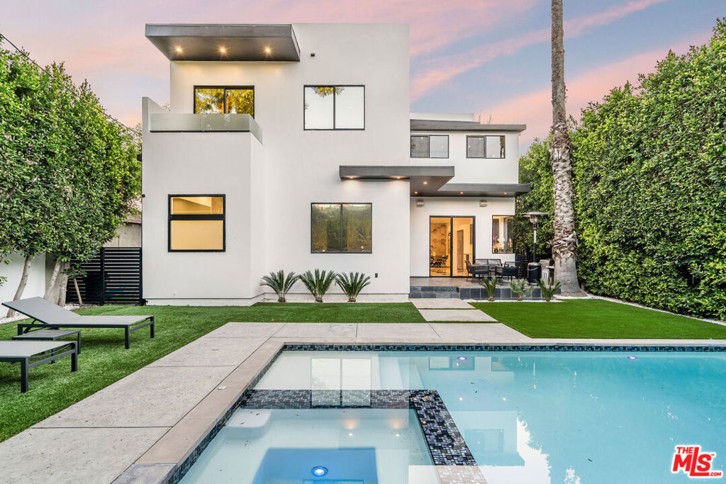 Stunning MODERN recently updated home located in the prime Library Square section of Sherman Oaks. Featuring 4B and 4 1/2B in an open floor plan of over 3,400 SF and sited on a gated lot. Bright Gourmet kitchen with custom cabinetry, stainless-steel appliances and, Caesarstone counter tops. Open to an entertainers backyard with a deck, saltwater pool, spa and cozy sitting area. Included on the first floor is a Family room with fireplace, a beautifully designed master bedroom with hotel styled bathroom, and two cozy bedrooms with a jack-and-Jill bathroom, and spacious powder room. The Second floor second family/media room open to a huge rooftop deck. A second master bedroom is specious & bright. Upstairs den creates a perfect fitness center. Other features included is surround sound system and, NEST HVAC controls. This property is ideally located just minutes from Venturas restaurant row, shopping centers, and the 405 and 101 Fwys.