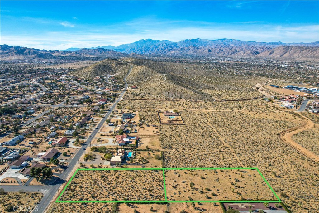 Rare Opportunity in Sky Harbor – Two Adjacent Lots Totaling 2.24 Acres! Welcome to a unique chance to own two side-by-side parcels in the highly desirable Sky Harbor neighborhood of Yucca Valley. Each lot is 1.12 acres, offering a combined total of 2.24 acres of flat, buildable land—ready for your vision. Whether you're looking to build a private estate, a family compound, or develop two separate homes, this property offers incredible flexibility. With breathtaking views in all directions, you’ll enjoy stunning sunrises, mountain vistas, and peaceful desert nights. Located in a well-established neighborhood surrounded by quality homes, this land provides the perfect blend of privacy, convenience, and potential. Utilities are nearby, and access is easy. ***The address is fictitious to help locate the property on GPS***