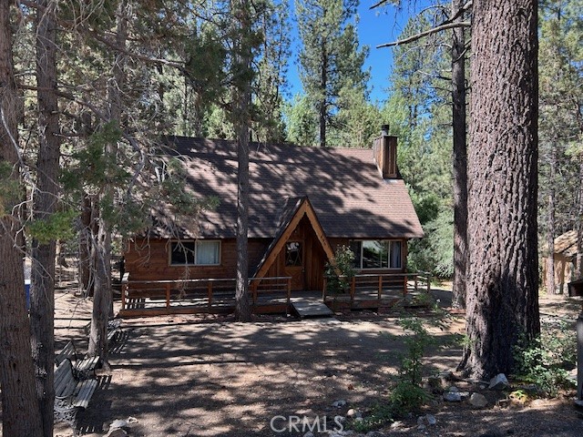 Great Fox Farm location under 500K with a 9720 square foot lot. This Sierra style cabin has lots of trees and backs onto a seasonal stream. Original T & G
paneling and vaulter ceilings make the most of the ski chalet vibe, just add mountain furniture and accents. 2 bedrooms downstairs and large loft bedroom upstairs. Separate laundry room off the kitchen with room for a full size washer and dryer. Easy access to storage building in fenced back yard from the long asphalt driveway. Plenty of room for boat storage.