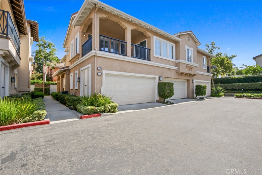 An updated corner unit in the Montilla neighborhood of Oak Creek, this 2-bedroom, 2-bathroom home offers nearly 1,400 sq ft of single-level living. Soaring ceilings and abundant natural light highlight the open-concept design, with a spacious living, dining, and kitchen area that’s perfect for entertaining. The home features hardwood floors, a private balcony for outdoor dining, and generously sized bedrooms including a primary suite with walk-in closet and dual sinks. The oversized two-car garage provides ample storage and SUV-friendly parking. Montilla residents enjoy their own pool and spa, along with access to Oak Creek’s resort-style amenities including multiple pools, tennis and basketball courts, parks, and walking trails. Ideally located near UCI, shopping, dining, John Wayne Airport, and award-winning Irvine schools, this home combines comfort, convenience, and a prime Irvine lifestyle. With fresh paint and brand new carpet, this home is ready for you to move right in!