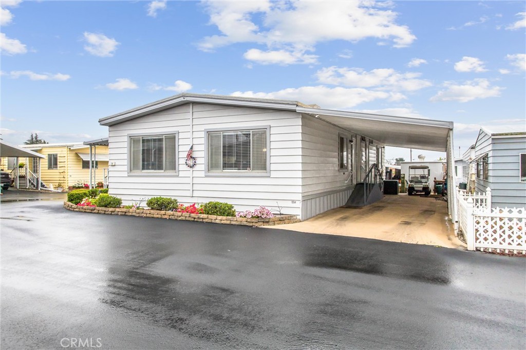 ***SELLER MAY CARRY THE LOAN WITH ACCEPTABLE DOWN PAYMENT AND TERMS!***WELCOME TO THE 50+ YUCAIPA LAND YACHT HARBOR! This UNIQUE AND RARELY AVAILABLE PARK is an RV club where a Membership is only $195/month. IF YOU HAVE OWNED AN RV for at least 1 year and agree to own an RV for 2 years after purchase, you can apply for the $195/month membership. IF YOU DO NOT OWN AN RV, you can still apply for the $650/month non-member space rent. Either is a fantastic deal as Residency within the park INCLUDES WATER, TRASH, SEWER, access to a COMMUNITY POOL, remotely operated FRONT GATE for extra security, CLUBHOUSE, and FREE RV STORAGE in a gated, lighted, and camera-monitored lot. Non-members can become members any time after they meet the criteria for membership. Now to the ABSOLUTELY BEAUTIFUL Mobile Home with OVER $60,000 IN RECENT UPDATES! Discover this beautifully updated home designed with senior living in mind. Offering over 1,500 square feet of inviting living space, this 2-bedroom, 2-bathroom gem includes a 1,248 sq. ft. mobile home plus an approximately 258 sq. ft. bonus room—ideal for a hobby room, office, den, or light exercise space. Step inside to find the spacious living, dining, and kitchen areas, which flow together in a bright, open layout. The kitchen has been thoughtfully updated with granite countertops and pull-out shelving, and includes a full suite of appliances: gas range, microwave, dishwasher, and refrigerator. Enjoy comfort year-round with newer central heating and air conditioning, an energy-efficient swamp cooler, and a 50-gallon water heater. The Master Suite is a true retreat, featuring a refreshed bathroom with a nearly new walk-in Jacuzzi tub for safety and relaxation. Additional updates include fresh interior and exterior paint, newer vinyl plank flooring and carpeting. Outdoors, the lush landscaping, pergola-covered seating area with table, chairs, and firepit (all included), create a peaceful setting for morning coffee or evening chats. A Tuff Shed provides plenty of space for tools, storage, or a small workshop. This home offers easy-care living whether you're relaxing at home in this quiet, friendly community or hitting the road in your RV—this low-maintenance property makes it simple to lock up and go and START ENJOYING LIFE YOUR WAY!