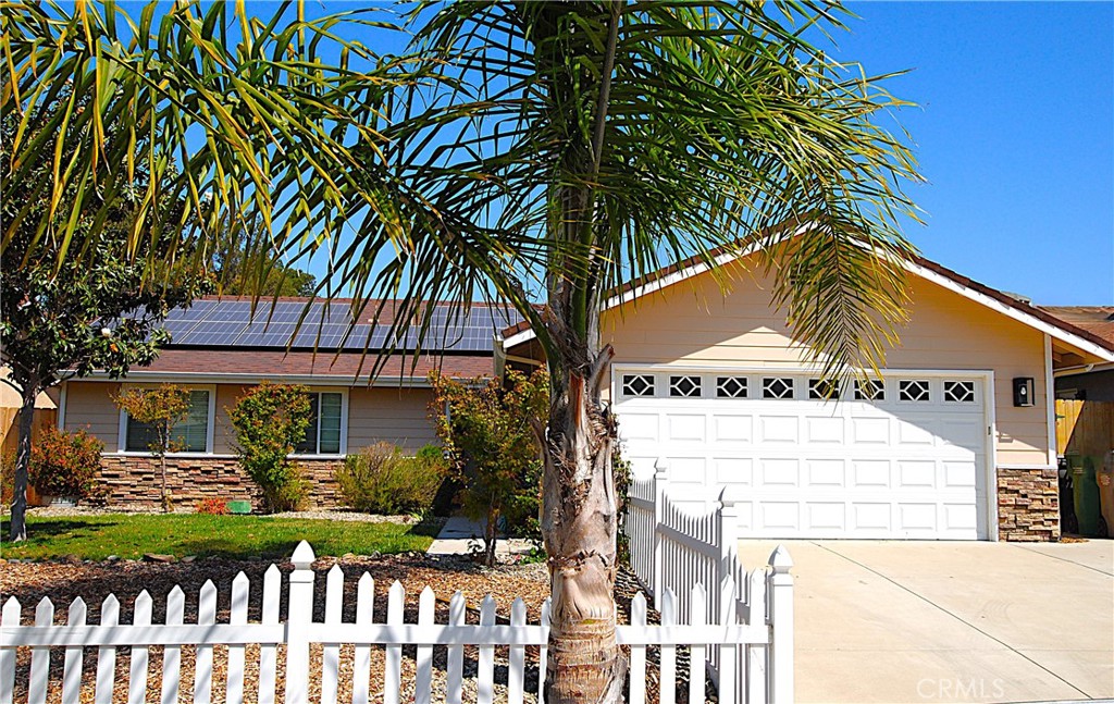 Nipomo is a growing area that is conveniently located between San Luis Obispo and Santa Maria, only ~15 minutes from Pismo Beach and close to wine country. Nipomo is known for it's fantastic year-round weather, casual lifestyle and country charm and this home fits right in! Located in an enclave of 9 homes built in 2009 that faces a ranch and has open space in the back. The private back yard has a custom BBQ-bar area made of imported hardwoods like Austrian Cyprus and Teak and corrugated steel siding designed for entertaining your friends and family! This single level 3 bedroom 2 bathroom ranch style home is ready for you to move in! The vaulted ceiling in the living room and slider door out to the backyard makes for a spacious feel. The kitchen features high end appliances like French door refrigerator, GE Profile 5 burner stove with convection and dual oven and granite counters. The beautiful hickory wood floors add style throughout the kitchen and dining room. The primary bedroom has a large walk-in closet and ensuite for your convenience. The 2 other bedrooms are good sized and one features a walk-in closet. To add to the awesome value is the owned 18 solar panels - which is extra so you can add a spa, car charger or AC. The yard has many producing fruit trees like lemon, orange, apple and grapevines. No HOA and friendly neighbors add to the appeal. If you are looking for country living but close to town, this is for you! With this price reduction, hurry won't last!