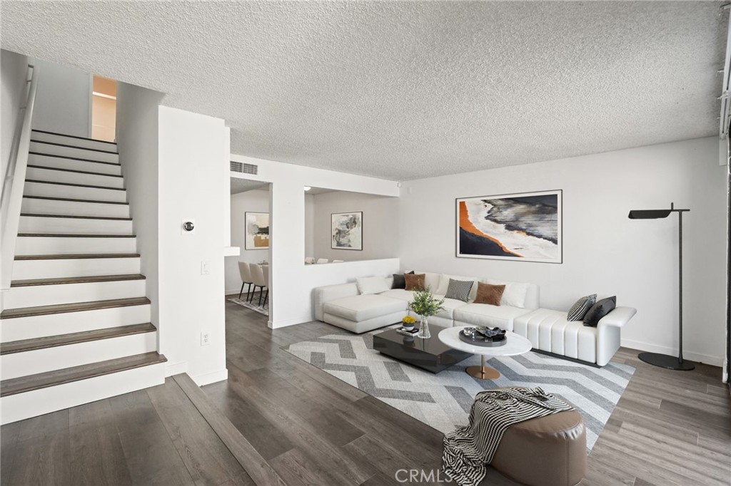 Welcome to this spacious two-story condo in the heart of Woodland Hills. With a practical layout and new vinyl flooring throughout, this home offers comfort, functionality, and room to make it your own.
The main level features two separate dining areas, a generously sized kitchen with ample counter space and modern appliances, and a cozy living room with a fireplace — perfect for relaxing evenings at home. Just off the living area, sliding glass doors open to a private enclosed patio, ideal for enjoying your morning coffee, entertaining guests, or getting some fresh air.
Upstairs, you’ll find two well-sized bedrooms, each with its own walk-in closet. One bedroom includes an ensuite bathroom, offering privacy and convenience. The laundry area is tucked into a hallway closet with hookups for a side-by-side washer and dryer.
Additional highlights include central air and heat, and two assigned parking spots in a gated garage. The community features a pool, spa, and landscaped courtyards, all within a secure and well-maintained complex.
Conveniently located near Warner Center, Westfield Topanga, The Village, restaurants, cafes, and with easy access to the 101 and 118 freeways — this condo offers space, comfort, and a great Woodland Hills location.