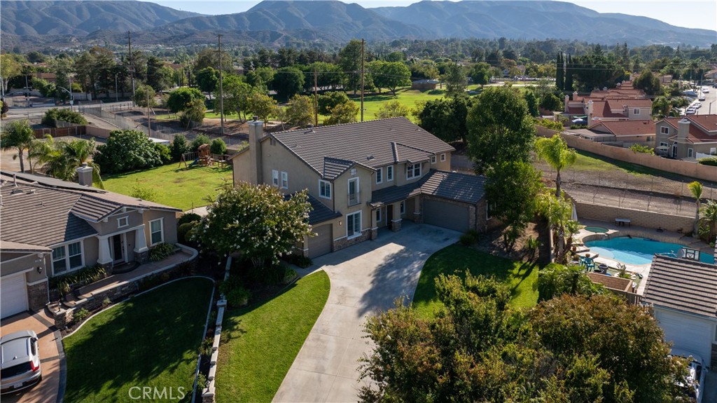 2150 Peony Street, Corona, CA 92882?5 Beds | 3 Baths | 4,411 Sq Ft | 18,295 Sq Ft Lot
$10,000 Lender Credit if home buyer uses preferred mortgage broker - The Lending Mamba, Inc. NMLS2467907
Welcome to 2150 Peony Street — a truly exceptional residence nestled on one of the largest corner lots in the neighborhood, boasting over 4,400 sq ft of beautifully designed living space on nearly half an acre. With an expansive open floor plan and abundant natural light throughout, this home offers the perfect blend of comfort, style, and functionality.
? Interior Highlights:
• 5 spacious bedrooms and 3 full bathrooms, including one bedroom and full bath downstairs — ideal for guests or multi-gen living.
• Formal living and dining areas plus a generous family room with fireplace, flowing seamlessly into the gourmet kitchen.
• Upgraded chef’s kitchen featuring granite countertops, center island with bar seating, stainless steel appliances, ample cabinetry, walk-in pantry, and butler’s pantry.
• Upstairs bonus loft and private office/flex space.
• Luxurious primary suite with a fireplace retreat, dual walk-in closets, French doors to a balcony with mountain views, and a spa-style ensuite with soaking tub, dual vanities, and separate shower.
• Finished 2-car garage converted for entertainment use with LVP floors and EV charging station.
??? Upgrades Include:
• Brand new LVP flooring
• Recessed lighting throughout
• New toilets
• Water softener and purifier system
• Reverse osmosis system
• Dual-zone HVAC, plantation shutters, and high ceilings
?? Outdoor Features:
• Eight-car driveway plus a 3-car garage (2-car finished)
• Private backyard oasis with 16 mature fruit trees including passion fruit, nectarine, pomegranate, fig, lime, dragon fruit, and more
• Covered patio perfect for entertaining, with plenty of space for a future pool
• Fully fenced yard with block walls for privacy
