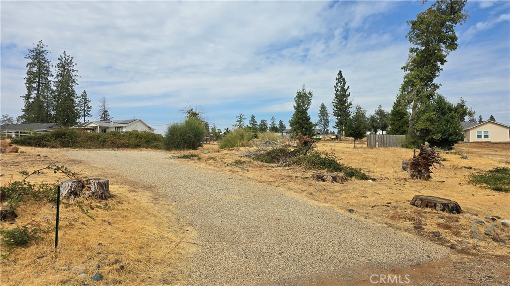 BEAUTIFUL LOT READY FOR YOUR DREAM HOME! Located in one of Paradise’s most desirable neighborhoods, this property comes with an existing 3-bedroom septic system (not yet inspected post-fire) and all utilities available at the street, including underground power lines that add both safety and curb appeal. The lot sits among many newly built homes, giving you a sense of community while enjoying the peace and beauty of this rejuvenated area. Just 12 miles from Chico and Hwy 99, commuting is easy while still offering the charm of small-town living. Ideally situated in the heart of Paradise, you’re only minutes from shopping, dining, schools, and parks. Outdoor enthusiasts will love the central location—just 10 miles south you’ll find Lime Saddle Marina at Lake Oroville for boating, skiing, swimming, or fishing, and 10 miles north is Paradise Lake, perfect for kayaking, canoeing, and quiet fishing in a serene no-motorboat zone where you might even spot bald eagles. Nearby, the West Branch of the Feather River offers swimming holes, nature walks, and even a little gold panning for the adventurous. With schools, the post office, and a shopping center close by, convenience is at your fingertips. Whether you’re looking for peaceful sunset views, a strong sense of community, or endless outdoor recreation, this lot is a wonderful opportunity to build your future in a thriving and welcoming neighborhood.
