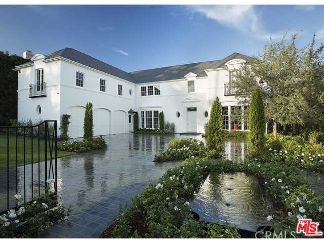 Style and Substance embody this brand new Georgian Estate in prime Beverly Hills. Completed in 2015 and designed by Thomas Proctor, this exquisite traditional is set to become a landmark. Conceived to blend 1930's period details with modern living; features include soaring 11ft ceilings, walnut paneled library w/bar, vast formal living room, generous dining room and sun filled kitchen/family room. Public rooms look out to beautifully landscaped grounds and pool. Luxurious master suite w/ dual baths in book matched marble. Total of 8 bedrooms/9 baths plus 3 powder rooms. Ideal for a large family, 5 bedrooms upstairs with adjoining play room. Entertainment level offers state of the art screening room, sit down wine cellar and gym. Pool house includes bedroom suite and living room with covered terrace. Perfect for guests. A rare and special offering. Shown only to prequalified Buyers.