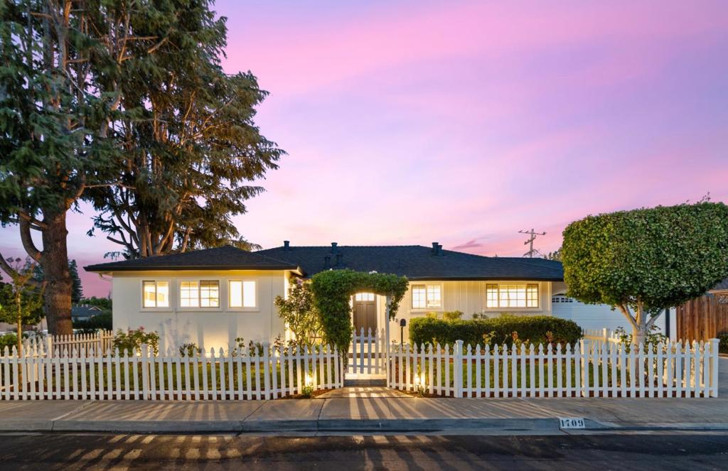Beautifully maintained 4-bedroom, 3-bathroom home with a brand-new roof on a spacious corner lot in one of Mountain Views most desirable, well-established neighborhoods! Offering exceptional curb appeal, award-winning schools, & comfortable living, this property is the perfect blend of charm and convenience. Fresh exterior paint & a new modern front door set the tone for the inviting interior, where updated door & cabinet hardware, recessed lighting, & vibrant landscaping enhance the homes warmth and style. The updated kitchen features granite countertops, stainless steel appliances, & both a separate breakfast nook & dining area for versatility. All bedrooms are equipped with built-in closet spaces & both bathrooms have been thoughtfully updated. The garage has been transformed into a versatile living area, complete with a full bathroom & laundry area. Perfect as a guest suite, home office, or expansive recreation room with a home theater or projector. If preferred, it can be easily reverted to its original use as a garage. Enjoy unbeatable access to award-winning schools, parks, shopping, downtown Mountain View & major commute routes. This home blends location, flexibility, and style - dont miss the opportunity to make it yours! 4th bed / 3rd bath are part of garage conversion.