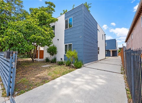 Photo of 645 W 97th ST, Los Angeles, CA 90044 (MLS # PW26202421)