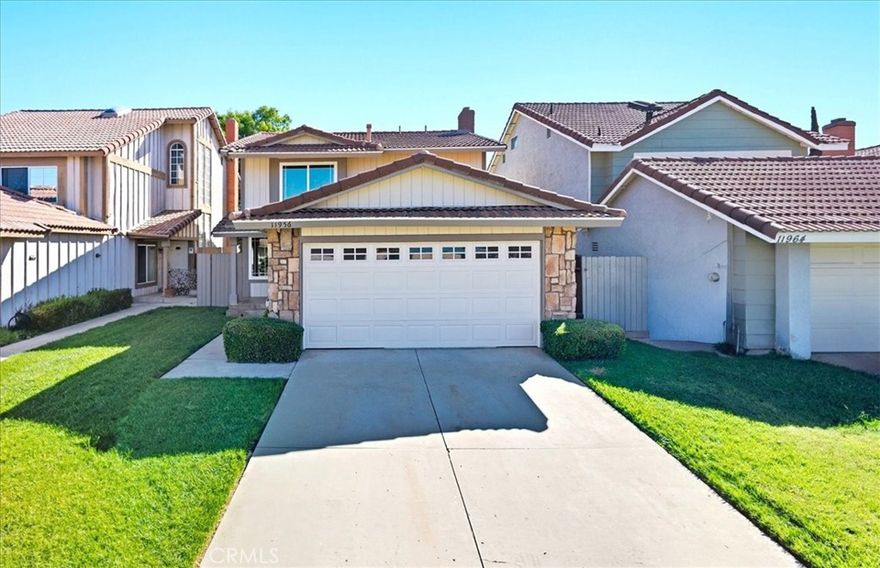 Beautiful move-in ready, 3-bedroom 2.5-bath home with plenty of curb appeal, features fresh interior and exterior paint, designer carpet and wood luxury vinyl flooring!!  The main level offers a bright living room with large windows and a sophisticated fireplace, leading to a spacious kitchen with two breakfast bars—one with overhead cabinetry and another adjacent to a convenient half bath.

Upstairs, the open second floor provides plush carpeting, and direct access to all bedrooms. The primary suite includes a private balcony with custom hardware and a large en-suite bath with dual sinks and a soaking tub. Two additional bedrooms share a full bath with a tub.  The back yard is ready for relaxing or entertaining, with a convenient patio deck and plenty of lush lawn! The front-facing 2-car garage with laundry, and quiet neighborhood, make this a wonderful place to call home!
