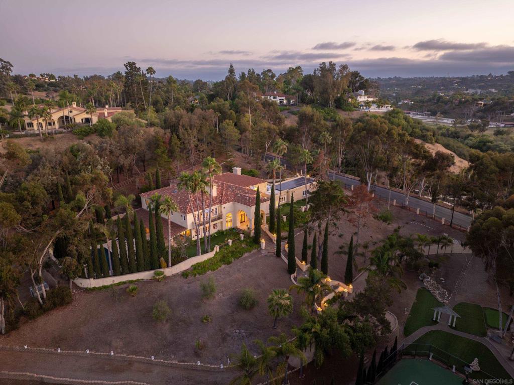 Welcome to 459 Flores De Oro in South Pointe Farms, an exceptional opportunity to create your own world-class estate behind the gates of one of Rancho Santa Fe’s most exclusive communities. Set on 3.5 usable acres with mature landscaping, this nearly 10,000 sq ft residence offers incredible upside potential—remodel, add an ADU, or design a truly bespoke compound. The property is zoned for up to three horses and includes a tennis and pickleball court, a heated saltwater pool, and a secondary driveway for added convenience. A grand 28-foot entry sets the stage for 6 spacious bedrooms and 6 bathrooms w 2 half baths, each with its own en-suite bath for ultimate privacy and comfort. Separate guest or staff quarters with a private entrance add flexibility for multi-generational living or rental income. Owned solar with 48 panels delivers energy efficiency and cost savings. Some photos are a digital modernization of the room, enhancing the vision of potential upgrades. Additionally, this is one of the lowest price per square foot homes in the Ranch. Whether you choose to enjoy it as-is or transform it into your personal legacy estate, this property offers rare scale, versatility, and the chance to craft a prestigious Rancho Santa Fe retreat exactly to your vision. Welcome to 459 Flores De Oro in South Pointe Farms, an exceptional opportunity to create your own world-class estate behind the gates of one of Rancho Santa Fe’s most exclusive communities. Set on 3.5 usable acres with mature landscaping, this nearly 10,000 sq ft residence offers incredible upside potential—remodel, add an ADU, or design a truly bespoke compound. The property is zoned for up to three horses and includes a tennis and pickleball court, a heated saltwater pool, and a secondary driveway for added convenience. A grand 28-foot entry sets the stage for 6 spacious bedrooms and 8 bathrooms, each with its own en-suite bath for ultimate privacy and comfort. Separate guest or staff quarters with a private entrance add flexibility for multi-generational living or rental income. Owned solar with 48 panels delivers energy efficiency and cost savings. Some photos are a digital modernization of the room, enhancing the vision of potential upgrades. Additionally, this is one of the lowest price per square foot homes in the Ranch. Whether you choose to enjoy it as-is or transform it into your personal legacy estate, this property offers rare scale, versatility, and the chance to craft a prestigious Rancho Santa Fe retreat exactly to your vision.
