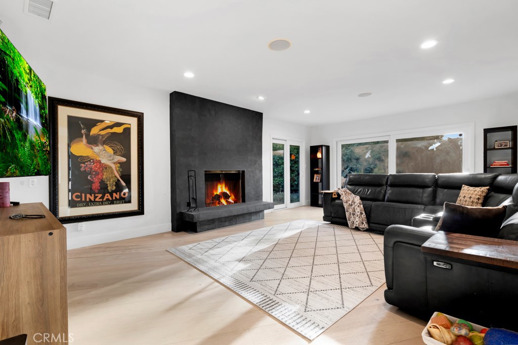 SELLER IS MOTIVATED. Get ready to fall in love with this incredible, single story, Lynn Ranch home. With 4 bedrooms & 3.5 bathrooms & just over 3000 sqft of floor plan you will quickly see why this home & area are so special. Living in Lynn Ranch is a privilege that everyone should be lucky enough to experience. I promise you will love sitting at your dining room table while having your coffee & looking out the window to the open field with deer roaming around in the mornings. Inside the modern double door entry you will find gorgeous hardwood floors, recessed lights & designer touches throughout. The spacious living room features a beautiful fireplace that is covered w/ a stunning ebony roman clay finish. This home maximizes indoor/outdoor living w/ all of the bedrooms, living room & family room having direct access to the yards. The kitchen features tile floors, cherry cabinets, quartz counters & high end stainless steel appliances including Thermador & Bosch as well as a wine fridge. Off the kitchen you will find the family room w/ vaulted ceilings, skylight & French doors out to the tropical paradise backyard. The master suite is huge & features a large bathroom with dual sink custom vanity, slate tile, a massive spa tub & direct access to the pool area. The highlight of the master is the closet space. The master bed closet is 8'x 28' ensuring even the largest shoe collection will be accommodated. The master bedroom also has crown moldings & an modern accent wall. One of the bedrooms has been turned into a home office with built in desks & bookshelves. The other 2 rooms are both spacious & have a newly remodeled jack & Jill bathroom. All of the bedrooms have ceiling fans. The backyard of this home is what most people are obsessed with. This is an entertainers paradise w/ a tiki theme. In addition to the sparkling pool & spa you have a built in Viking BBQ, large patio area, lush vegatation & a tiki bar that overlooks the pool & will make you feel like you are on vacation every day. Enjoy the sunsets from the larger of the 2 decks or sneak off through the trees to smaller deck. Other highlights include a 3/4 bath off the pool, a large laundry room, landscape lighting in front & back, 2 car attached garage w/ EV charger, OWNED solar & 2 Tesla power walls. Don't miss your chance to own a home others dream of. ASK ABOUT A RATE BUYDOWN.