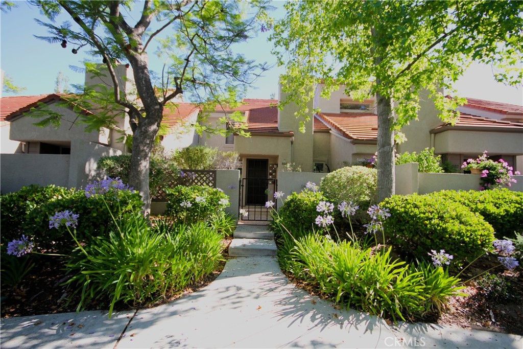 Gorgeous two story townhome at the top of the Hillside Hidden Canyon Community. Amazing views, parks, and recreation just steps from your front door. It has a spacious living room and floor plan. Including vaulted ceilings and a warm fireplace. Upgrades throughout, with plantation shutters, dual-pane sliding glass doors. BBQ on your wonderful entertainment patio. Stylishly Recessed lighting and granite counter-tops. There is plenty of storage and direct access to your two-car garage with coated flooring. Upstairs features the primary bedroom. Two additional bedrooms are upstairs with another bathroom. Step outside and be greeted with vista views of rolling hills with endless hiking and trails. There is plenty of parking for your guests steps away. Hidden Canyon Community offers three Pools, six Spas. Located Near Great Schools, The Promenade at Westlake, Restaurants, Shops, Costco, Movie Theaters. Enjoy all that Westlake Village has to offer, then escape to your hideaway in the hills.