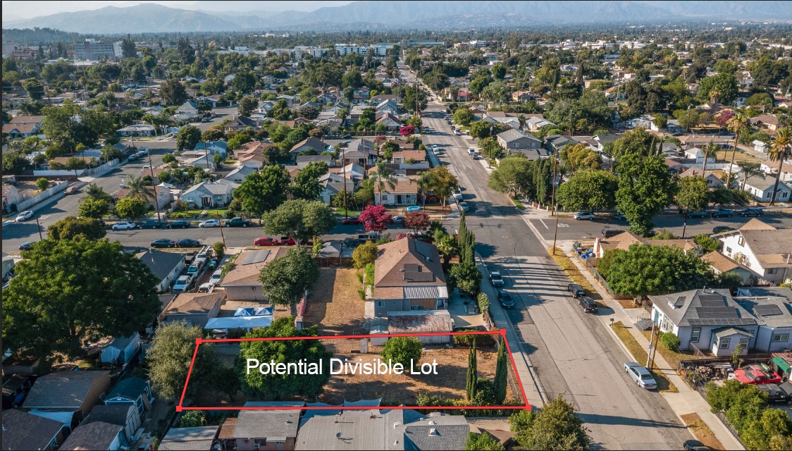 Attention Agents, In-Home Income Seekers, Investors, Flippers, Builders and Land Lovers! Potentially divisible lot! Rare opportunity in Pomona! This oversized 16,156 sq ft flat corner lot (approx. 0.37 acre) offers exceptional potential for development, expansion, or multigenerational living. With a side-by-side lot orientation, it’s ideal for a future split into two independent homes—unlike a typical flag lot configuration. Perfect for investors or those who simply want to move into a quiet, tree-lined neighborhood, this property is also great for in-home income seekers—those who live in one part and rent out the other. The home is move-in ready, featuring three generously sized bedrooms, 1 full bathroom, 2 three-quarter bathrooms, and a versatile bonus room perfect for a home office, guest room, or creative studio. Per seller, the home has been rewired and re-piped (buyer to verify). A solar system installed in 2022 (buyer to assume lease) keeps utility costs low. A long driveway, detached garage, and massive backyard and side yard provide space, privacy, and flexibility. And don't forget the backyard bonus - a mini farm orchard with grapefruit, dragon fruit, orange, peach, and jujube trees. This is a must-see property—photos can’t capture the spacious feel or the potential of the land. Act fast - opportunities like this don't last!