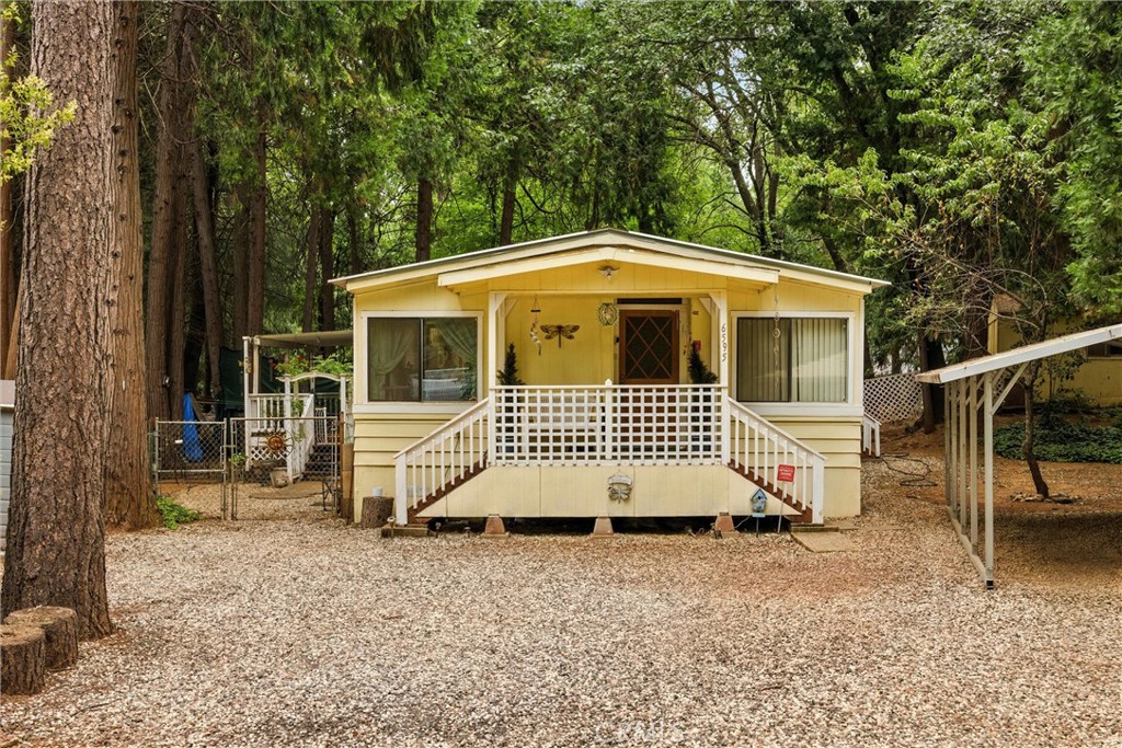 This charming move-in ready 2-bedroom, 2-bathroom home with an office, features ample thoughtful updates for your peace and comfort. Enjoy peace of mind, with a newer metal roof, a cozy wood stove & central heating, an efficient swamp cooler & AC unit, and a sleek newer stovetop. As an all-electric home, reap the benefits of a covered installed generator, ensuring no power worries. The outdoor space is a gardener's dream. We're talking walnut trees, two avocado trees, a lime tree, a lemon tree, and two apple trees—your personal orchard awaits, complete with a greenhouse for all your gardening dreams to flourish! Needing a little extra space? 2 storage sheds are included, one of them is even hooked up to electricity for all your workshop needs. Finally, there is also a small private road leading to the back of the property, meaning endless possibilities for RV parking, boats, or all your adventure toys. Another amazing feature is that this home has an assumable loan at just 2.75%!