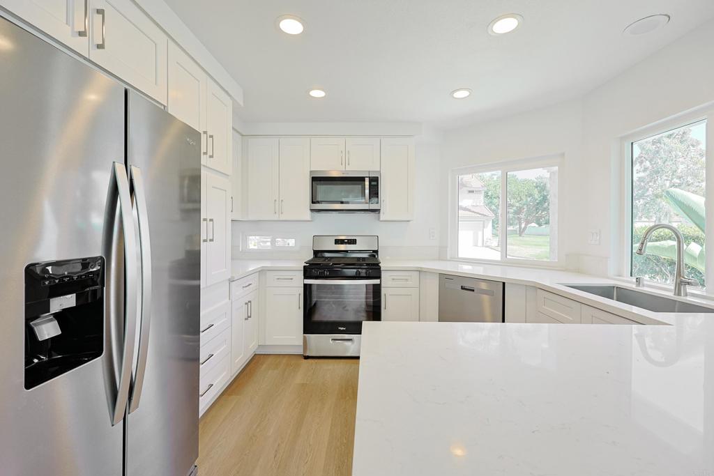 Welcome to 249 Blackbird Way, a beautifully remodeled home tucked away in a charming cul-de-sac in Oceanside. This light-filled residence has been thoughtfully updated from top to bottom, featuring fresh interior and exterior paint, brand new flooring throughout, and soaring ceilings that create an inviting space. The stunning new kitchen boasts sleek cabinets, modern countertops, and upgraded finishes—perfect for both everyday living and entertaining. Additional upgrades include dual-pane windows, stylish light fixtures, and updated bathroom vanities, all designed to blend comfort with contemporary style. A highly desirable main floor bedroom and full bathroom provide convenience and flexibility for guests or a home office. Natural light pours into every room, highlighting the home’s airy design and warm atmosphere. Situated on a peaceful cul-de-sac, this property offers both privacy and community, all while being just minutes from schools, shopping, dining, and the beach. Don’t miss the opportunity to make this move-in-ready gem your new home!