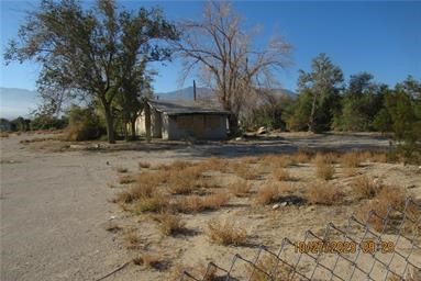 GREAT Commercial property at entrance of Lucerne Valley business district. All value is in the land. Old well and septic on site. Utilities at property. Hwy 18 is about to be expanded including location of this property. Owner may carry with 25% down.