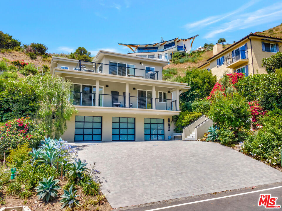 Stunning close in 2019 contemporary home designed for easy living. 3 car garage with elevator access to floors 1 (Three bedrooms and en suite baths) and 2 (Kitchen, dining and entertaining with spacious decks and views.). Walk to newly restored Las Flores park and Dukes Restaurant (slated to reopen July of 2025). Owners will rent it furnished or unfurnished. Rent includes gardener. Closein location is only 8 miles to Santa Monica and the Palisades. Charming private and well landscaped sundeck. This is the first time this home has ever been shown to the public. Quiet and peaceful. Use of La Costa Beach and Tennis Facilities are not inluded but can be negotiateed for an extra annual Fee paid directly to the Club.
