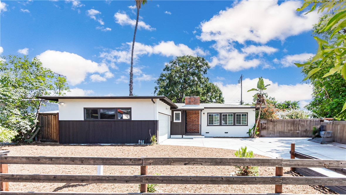 Just steps from the Claremont border, this beautifully renovated 3 bed 1 bath ranch-style home sits on a large lot with mountain views, under the canopy of a large California oak, with endless possibilities — including space for an ADU or other structures. Step inside and you’ll feel the care in every detail. The bright, open living space features new laminate floors, fresh paint inside and out, and a working wood/gas fireplace perfect for cool evenings. The newly renovated kitchen is a dream — quartz countertops, soft-close cabinets and drawers, a brand-new dishwasher, recessed lighting, and custom wooden shelving give it both style and function. The bathroom has been fully updated too, with all the modern touches you’d expect. All the major upgrades are done: new plumbing, new electrical in the kitchen and bath plus upgraded electric in the bedrooms, a newly installed energy-efficient mini-split system for heating and cooling, dual-pane windows, and a laundry area with brand-new hook-up valves and electric. Outside, the property shines with a fenced yard, a large brick patio for entertaining, and driveway access from both the front and rear — including a double-wide gate and RV parking. The two-car garage comes with remotes, plus driveway parking for three more vehicles. This home’s location offers the best of both worlds — a quiet, established neighborhood where neighbors have been here for decades, yet you’re walking distance to shopping, restaurants, and minutes to freeways for an easy commute. Move-in ready, Claremont-adjacent, and packed with thoughtful upgrades — 1820 Indian Hill is more than just a house. It’s a place to put down roots.