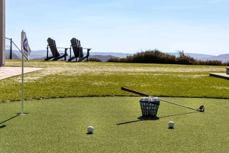 The High Valley lifestyle is one the best kept-secrets in San Diego! Tucked away in the scenic hills of Poway, California, an easy commute to the heart of San Diego. With a 2-acre minimum, High Valley offers a rare blend of privacy, serenity, and peace. A design-forward beauty poised atop a premier parcel. Epic entertaining opportunities await with two outdoor kitchens, entertainment lounge and a poolside backdrop for unforgettable gatherings. Southern California living at its best with sweeping valley and mountain vistas!  Expansive turf lawns for unlimited fun and activity, polish your golf game on the putting green, and work that perfect swing in the custom batting cage and driving range. If you can dream it, you live it. Step inside to discover an open-concept layout, an entry-level primary suite, a chef-caliber kitchen with top-tier appliances, and expansive living spaces. A dedicated study area and oversized loft offer flexibility for work or play. Energy-efficient features include owned solar, a TESLA electric car charger, LED recessed lighting, dual tankless water heaters with on-demand pumps, radiant roof barriers, two-zone HVAC with programmable thermostats, and low-VOC paint. Newly painted inside and out in 2024. Enhancements include a solar-heated, saltwater pool and spa, elevated view deck, putting green, fitness zone, two BBQ areas, artificial turf, batting cage, outdoor shower, and multiple lounging areas, all curated to create an entertainer’s dream or private retreat. This extraordinary property is also located within the boundaries of Poway’s award-winning schools. The long private driveway ensures plenty of parking and privacy, seamlessly blending sophistication, innovation, and lifestyle, this is Southern California living at its finest.