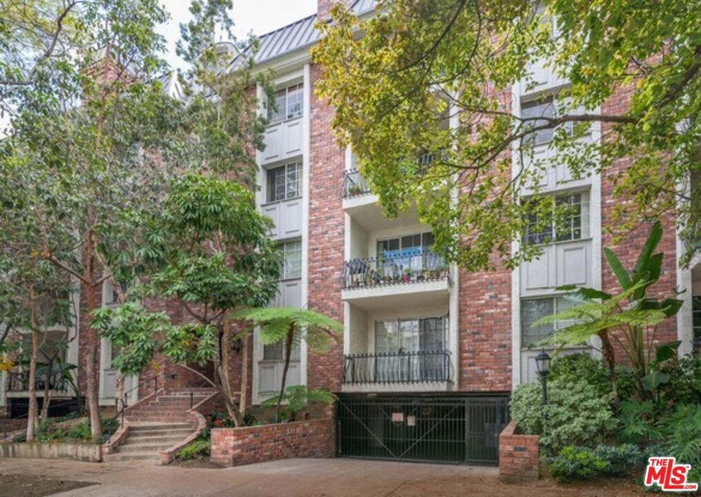 Situated in the heart of Westwood, this renovated 2-bedroom/1.75-bath condo is a delightful blend of style, sophistication, and modern elegance. Nestled against an enchanting, lush courtyard, you enter this rear unit through the dreamscape surrounded by green foliage, a serene stream, and a bridged walkway. A beautiful entryway welcomes you home, where you are led to the spacious living room and dining areas accented by an elegant fireplace, rich wood flooring and recessed lighting. A large balcony overlooking the lush greenery creates seamless indoor-outdoor living. The gourmet kitchen is equipped with ample cabinetry, stainless steel appliances and an idyllic breakfast/office nook. The primary bedroom suite offers a generous walk-in closet with custom built-ins, and a lavish bathroom with an oversized walk-in shower. Spacious second bedroom, and an adjacent bathroom with a convenient tub/shower combo. The unit features high ceilings and crown moldings throughout. Additional highlights include in-unit laundry, and central air conditioning and heating for optimal comfort. This charming brick building also provides the convenience of two gated parking spaces, a pool, a gym, and guest parking. Kelton Place is a hidden oasis on a beautiful tree-lined street in a prime Westwood location with close proximity to Century City, Westwood Village, UCLA, 405 Fwy access, parks, shops, restaurants, theaters, and markets including Bristol Farms, Whole Foods, and Trader Joe's. Experience the best of Los Angeles right at your doorstep.