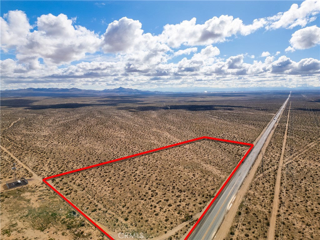 Large 10.6 acre lot Zoned - PERFECT FOR GAS STATION OR RETAIL - MIXED USE RL-5. Great potential to build homes right off of Highway 395. Hard to find large acreage on Hwy. 395 Great Highway visibility! Current zoning is Residential, but can be changed to Commercial or Mixed Use - check with County. Buy and build now, or Buy and Hold - Buy in Path of Future Development.
