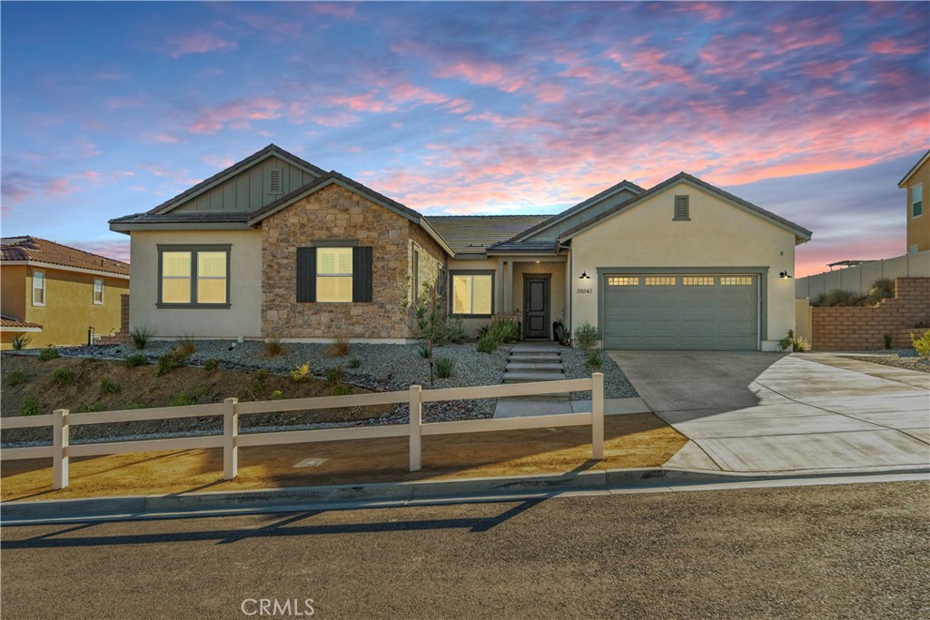 Turnkey Beauty in Joshua Ranch Skyridge Community. Welcome to Joshua Ranch, a gated community perched in the foothills of Palmdale. With panoramic views, .47 acre lot, owned solar, beautiful finishes & a phenomenal 3,572sqft layout, this home is an opportunity that should not be missed! Starting with its pristine, low maintenance exterior, the tone is set for the beauty that awaits inside. Entering the home, you find yourself in a bright entry with beautiful flooring & plantation shutters that adorn the entire home. To the right a tidy alcove with a half bath, closet and access to the 3 car garage. To the left, the first of 3 living spaces, great for a sitting or dining area. Continuing to the heart of the home is a chef's dream kitchen, dining area and large family room, all sharing a grand open space with beautiful natural light. In the kitchen you will fall in love with the beautiful aesthetics created by recessed lighting, sophisticated tile backsplash, the abundance of crisp white shaker cabinets, huge island w/ seating & pendant lighting, butlers pantry and large walk-in pantry. In the living room the sophistication continues with a sleek recessed electric fireplace & large glass slider that opens in both directions, providing a stunning view of the pristine backyard and phenomenal panoramic views of the surrounding foothills. Travelling back through the butlers pantry, you arrive in the front of the home and to the right, a short hall that takes you to a large, versatile bonus space. To the left you will find 3 impressively sized bedrooms, laundry room & a full bath, all well appointed and beautiful. To the right, proceed to the impressive primary suite with 2 huge walk in closets, a bath with spa ambiance & clean lines. Words alone cannot impart the beauty, sophistication & versatility of this home. Only in person will you feel the full breadth of what it offers, so come see it today and start envisioning life in the prestigious Joshua Ranch Community!