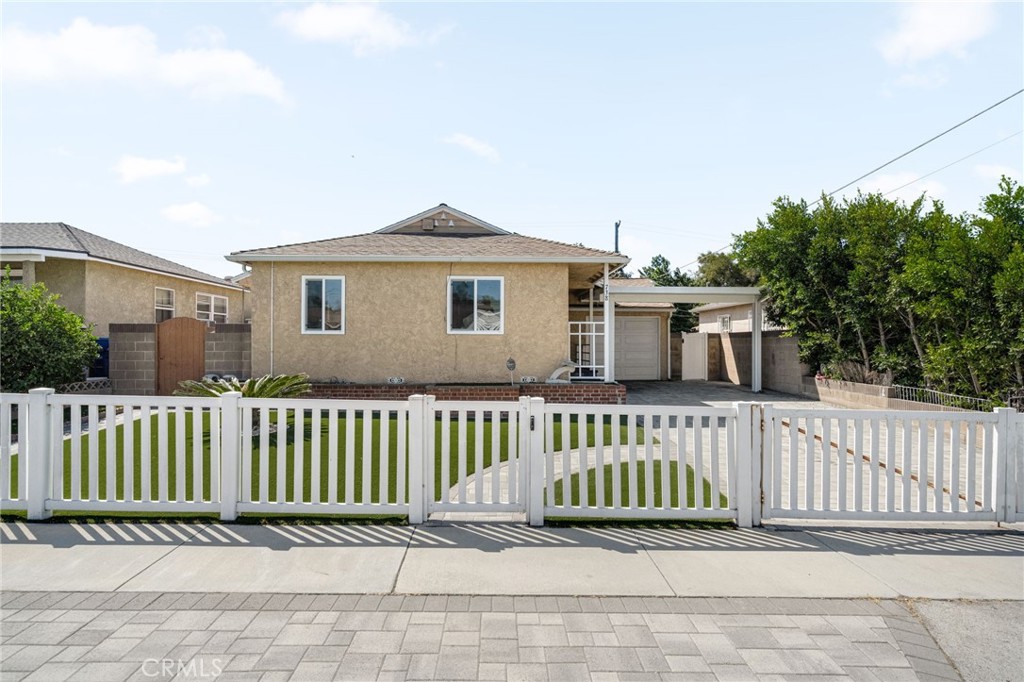 A beautifully updated single family home located in the heart of Gardena. This spacious residence offers 3 bedrooms, 2 bathrooms, and approximately 1,540 square feet of living space on a 5,251 square foot lot. Originally built in 1949, the home has been thoughtfully renovated to blend modern upgrades with timeless charm. Inside, you’ll find fresh new paint, luxury vinyl flooring, upgraded lighting, recessed lights in both the living room and family room, stylish new interior doors, and bathrooms enhanced with new vanities and sink faucets. The home also features newer double pane windows that fill the rooms with natural light while improving energy efficiency. The kitchen offers functionality with plenty of storage and counter space, while the bedrooms provide comfort and privacy for the whole household. A dedicated laundry room adds convenience to everyday living. Step outside to a private backyard designed for low-maintenance enjoyment, featuring drought-tolerant landscaping with artificial turf and pavers, along with a turf shed for added storage and flexibility. It’s the perfect setting for entertaining, gardening, or simply relaxing. Additional highlights include central air conditioning, a one-car garage, and leased solar panels that provide energy efficiency and must be assumed by the buyer. The property is also ideally located close to schools, shopping, restaurants, and freeway access for an easy commute.