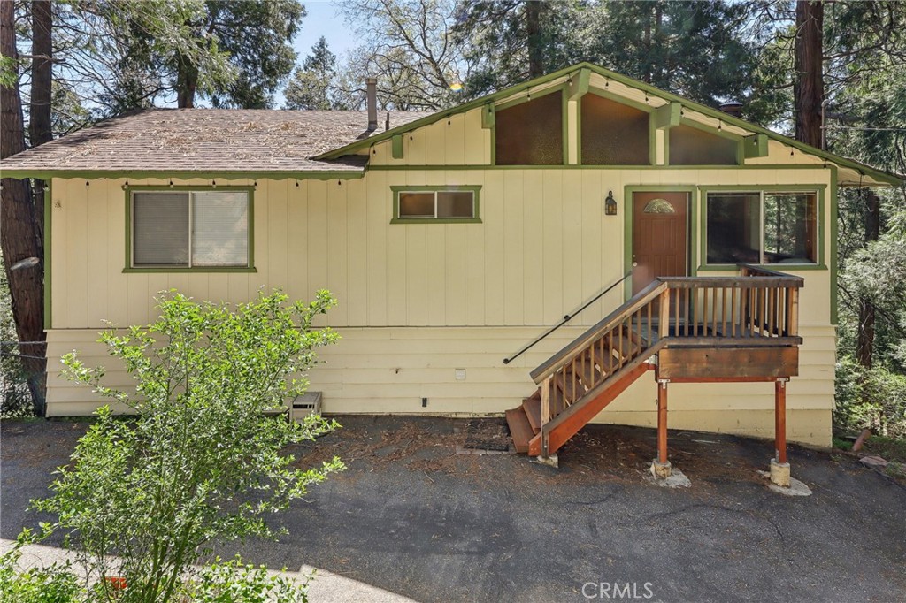 Mountain Retreat with Views, Space & Character
Welcome to your ideal mountain getaway in the heart of Crestline! This inviting 4-bedroom, 3-bathroom home offers 1,600 sq ft of flexible living space with breathtaking views, nestled on a rare double lot (17,125 sq ft / .39 acres) surrounded by mature trees and natural beauty.
Built in 1976, this well-maintained home blends rustic charm with modern updates. The open-concept main level features a bright and airy living space, large windows, wood-burning fireplace, and an updated kitchen with a breakfast bar that flows into the dining area. Step outside onto your spacious wood deck and soak in panoramic views of the San Bernardino mountains—perfect for morning coffee or evening entertaining.
The home offers two light-filled bedrooms on the main floor that can be used as guest rooms. The primary suite is tucked away on the lower level, featuring an en suite bath and two closets, including a cedar-lined closet. Also on the lower level is a cozy family room, a guest room, a laundry area, an additional bathroom, and a versatile unfinished bonus room—ideal for a storage space, workshop, den, craft or sewing room, or even a future granny flat or studio apartment.
Additional features include:
4 bedrooms | 3 bathrooms (1 full, 2 three-quarter)
Detached tandem garage with built-in workbench
Wood-burning fireplace for cozy winter nights
Recently upgraded flooring on the main level
Extra parking on a peaceful cul-de-sac—perfect for guests
Furnishings may be negotiable for a turnkey experience
Close to hiking, Lake Gregory, and charming Crestline shops and dining
Whether you’re searching for a peaceful full-time home, a weekend getaway, or an investment with potential, this Crestline charmer offers space, privacy, and classic mountain appeal.
Don’t miss this unique opportunity—schedule your private showing today!
Extra parking in cul-de-sac. Furnishings may be negotiated.