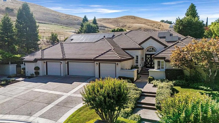 SHOWSTOPPER! Discover a premier sanctuary on a 1.19 acre lot, bordering open space within the coveted Northridge Estates. This single story masterpiece is the epitome of luxury living and the ultimate entertainer’s paradise. Step into the expansive great room, an architectural marvel w/ soaring vaulted ceilings. The gourmet kitchen features top-tier appliances, including a Sub-Zero refrigerator, Bosch dishwasher, Electrolux dual ovens, pot filler enhanced cooktop, plumbed coffee maker, 2 sinks, large island, & huge pantry. Entertain effortlessly w/ a fully stocked bar with 3 refrigerators, ensuring you’re the perfect host for any occasion–from intimate gatherings to grand festivities. Indulge in a moment of relaxation in your bespoke temperature-controlled wine cellar and adjoining cigar room. 4 spacious bedrooms include office w/ custom-built cherry cabinetry & plush primary suite w/ fireplace & private hot tub. All 5 baths have been updated w/ highest quality fixtures. The private backyard oasis w/ pavilion, outdoor kitchen, pool & spa will make everyday feel like you’re on vacation. Impeccably maintained, 2 newer HVAC systems, & owned Sunrun Solar. With 4408 sqft of living space and a 4 car garage…this gorgeous estate delivers an unparalleled lifestyle of modern convenience.
