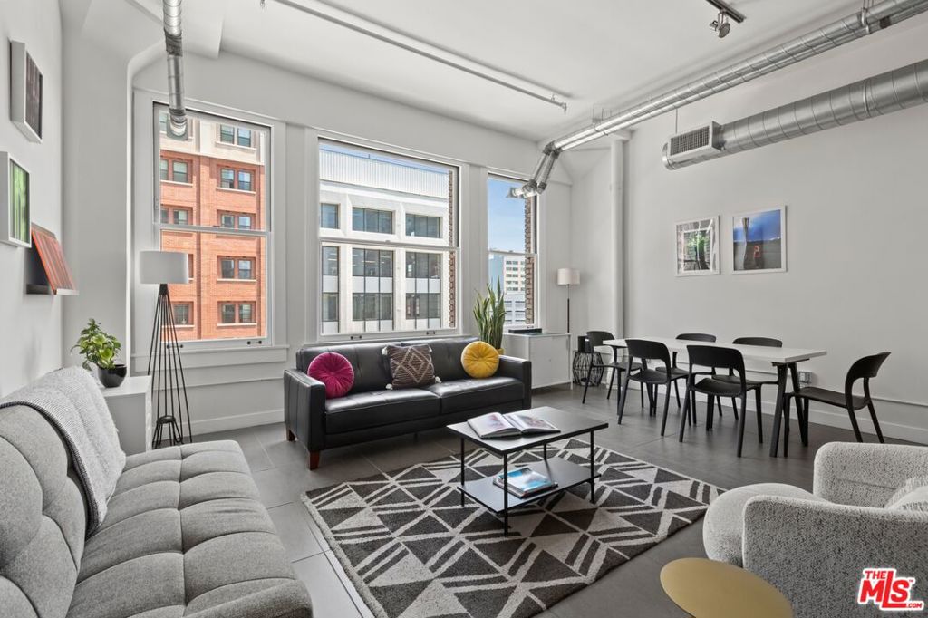 Live in the heart of Downtown LA at 939 South Broadway Lofts an architectural gem originally built in 1924 and reimagined in 2019. This bright fifth-floor unit features high ceilings, oversized windows with stunning Broadway views, and an open layout with a sleek, modern kitchen. Enjoy top-tier amenities like a rooftop pool and spa, fitness center, and 24/7 security. With low HOA fees and Airbnb-friendly status including eligibility for LA's Transient Occupancy Tax (TOT) permit this loft is perfect as a home, pied--terre, or investment. Located in the lively South Broadway district, steps from Whole Foods, the Ace Hotel, Apple Store, and some of LA's best dining and retail.