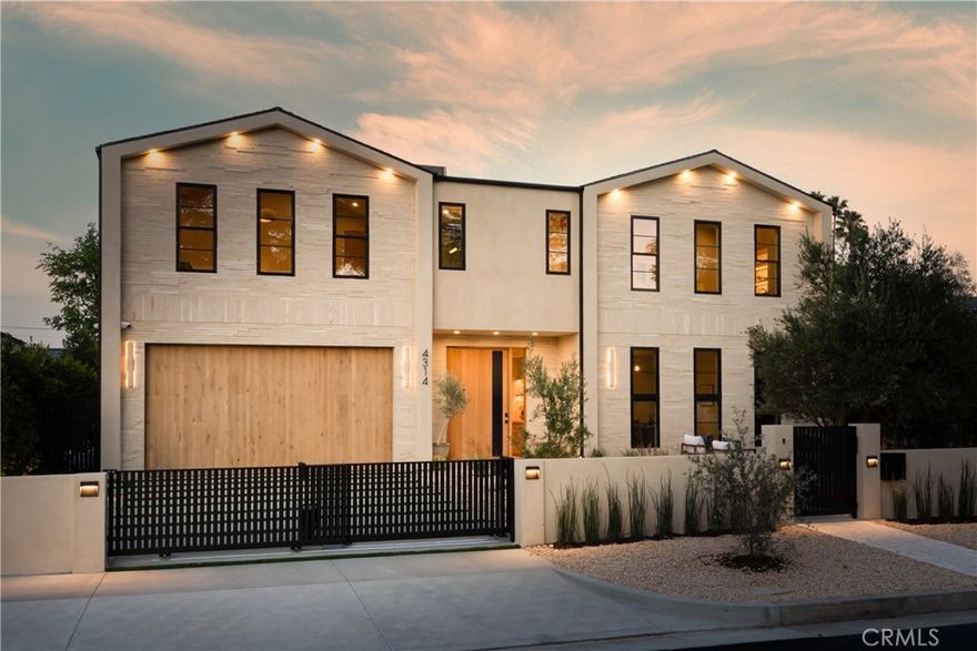 Experience elevated living in this striking new-construction home with a detached ADU, set on an expansive gated lot in prime Studio City. Thoughtfully designed for modern living, this open-concept floor plan is complimented by high ceilings and wide plank engineered oak floors that run throughout the home. The designer chef’s kitchen is a culinary showpiece, equipped with top-of-the-line appliances, stunning Taj Mahal quartzite countertops and a massive waterfall island. The adjacent living room and formal dining area are anchored by an oversized sliding glass door that disappears into the wall for seamless indoor-outdoor living, perfect for entertaining. The main level also features a state-of-the-art media room, ensuite bedroom and chic powder bathroom. Upstairs, a flexible loft space, laundry room and four generously sized ensuite bedrooms await, including a luxe primary suite with a private balcony, custom walk-in closet and sumptuous bathroom, complete with a soaking tub, large rainfall shower, smart toilet, double vanity and makeup vanity. Step outside to a serene backyard retreat surrounded by privacy hedges, where you’ll find a sparkling saltwater pool/spa, outdoor kitchen and low maintenance artificial turf yard. The detached ADU offers endless possibilities with a spacious living/dining area, full kitchen, 1 bed and 1 bath – great for guests, in-laws, a home office or wellness space. Additional highlights include a Control4 smart home system with integrated speakers and security cameras, a central vacuum system, paid-off solar panels and a two-car garage that's been prewired for an EV charger. This property is ideally located within the highly acclaimed Dixie Canyon School District and nearby Ventura Boulevard’s vibrant shopping and dining scene, the Shops at Sportsman Lodge and so much more.