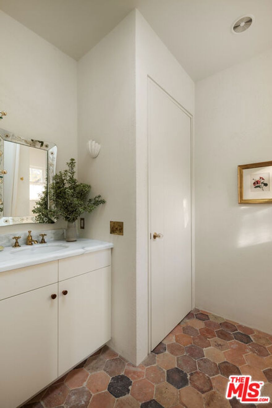 A California Ranch, Reimagined Tucked away in the serene embrace of Lower Mandeville Canyon, this masterfully restored ranch home is a study in understated luxury and impeccable craftsmanship. Set behind a secure drive gate and framed by native landscaping and mature trees, the single-story retreat seamlessly blends organic textures with bespoke finishes, creating a sanctuary that is as refined as it is effortless. Inside, radiant-heated European oak floors anchor the home in warmth, while Tuscan green plaster walls lend a timeless depth. Waterworks fixtures and hand-selected slabs of marble and stone punctuate the interiors with quiet opulence. The gracious primary suite, complemented by a richly paneled den and office, offers a private refuge, while the spa-like bath indulges the senses with a Nordic sauna clad in white Alaskan cedar, sun-drenched skylights, and direct access to a secluded meditation garden. Beyond the interiors, meandering pathways weave through the grounds, leading to an expansive deckperfect for intimate gatherings or grand entertaining. An outdoor kitchen, equipped with both gas and wood-fired grills, invites al fresco dining beneath the canyon sky. A home of rare distinction, where every detail has been meticulously curated. Private showings only. No broker or open houses.