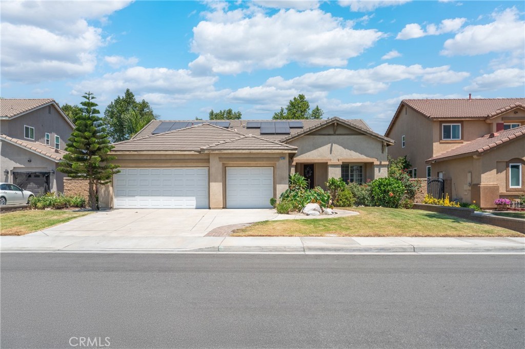 Welcome to this charming, modern and move in ready Single-Story Home! Accommodating 4 bedrooms, 2 bathrooms, and 3-car garages. Spanning 2,098 sqft. on a 6,534 sqft. lot. The front and back yards are easy to maintain. The long and wide driveway provides additional space. The interior boasts a formal living room, dining room and a family room with a cozy fireplace. The primary suite includes a large bathroom and a generous walk-in closet, while second and third bedrooms share a full bath with dual sinks and shower with tub. The fourth bedroom could be used as a playroom, study room, or office and includes a walk in closet. Ceiling fans in all bedrooms, plantation shutters complete this home with tile flooring that looks like wood, throughout. Solar panels help save money. The true highlight is its prime location. Nestled in a quiet, family-friendly neighborhood, minutes from Costco, 99 Ranch Market, Target, Home Depot, Vons, Walgreens, Kohl’s, future Civic Center, restaurants, fitness, entertainment, parks and award-winning schools. Easily accessible from 15, 60 and 91 freeways. Great opportunity to live and invest this comfort property. No HOA! No HOA! No HOA!