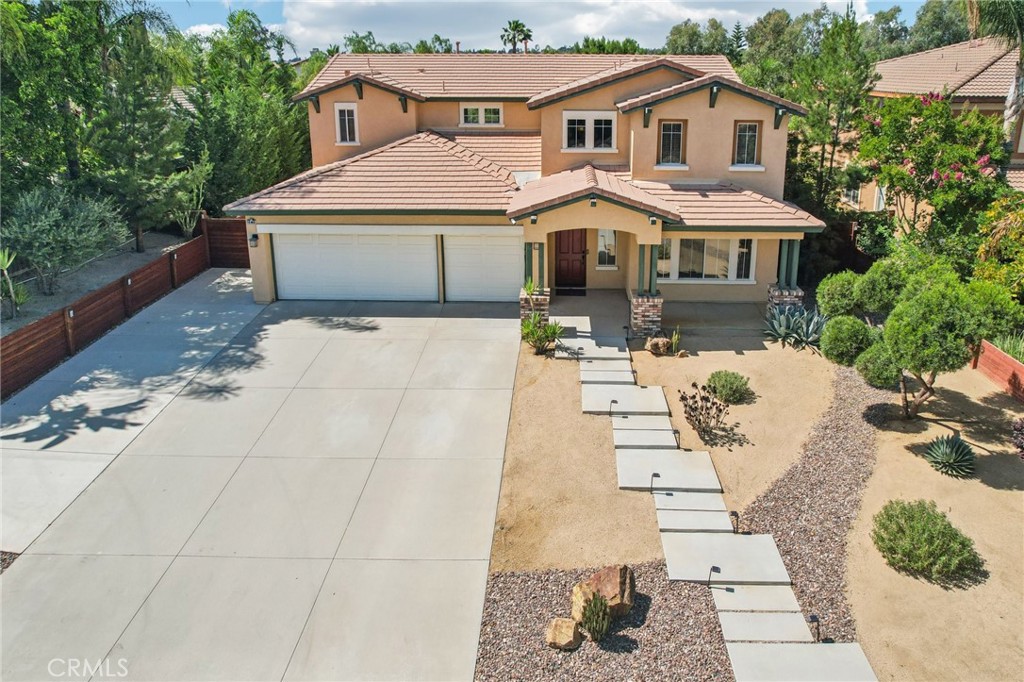 Located in the desirable Mission Grove/ Orangecrest community of Riverside, this beautifully maintained 4-bedroom, 3-bath home offers the ideal blend of space, style, and modern convenience. With 3,288 square feet of living space on a generous 12,632 square foot lot, this residence is designed for both everyday living and effortless entertaining. From the moment you enter, you’ll appreciate the abundant natural light that fills the home, creating a warm and inviting atmosphere. The spacious kitchen is a true highlight, featuring rich mission-style cabinetry, ample counter space, and extensive storage—perfect for the home chef or anyone who loves to host. Recent upgrades enhance comfort and efficiency, including a new HVAC system installed in 2025, a whole house fan for energy savings, and a tankless water heater for continuous hot water. Outside, the drought-tolerant desert landscape design provides curb appeal with low-maintenance living. Additional features include an attached 3-car garage and an extended driveway with plenty of room for RV parking. Ideally situated close to top-rated schools, shopping, dining, and easy freeway access, this home delivers exceptional value in one of Riverside’s most sought-after neighborhoods. Schedule your private tour today, this is one you don’t want to miss!