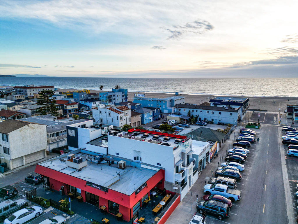 SW Beach Hotel is a 9-unit boutique hotel located near the corner of 11th Street and Hermosa Avenue near the pier in the heart of Hermosa Beach, California. Formerly an 11-unit multi-family building, the Property was purchased by its current owner in 2014, operated for several years as a multi-family property before being approved in 2020 and subsequently transformed and reopened as the SW Beach Hotel in 2023. The hotel offers 9 rooms within a two-story, wood-frame I-shaped structure. The primary amenity is the 1800-sf Rooftop Deck, which serves as a guest amenity and also a revenue center when rented out to hotel guests. Guestrooms are unique in design and decor, and range from 184 to 550 square feet. Six of nine rooms offer full kitchens and outdoor patios or balconies. A large 550-square-foot penthouse is proximate and offers easy access to the Rooftop Deck. Each guestroom is individually styled and named.Current ownership spent +/-1 million renovating the hotel, adding a small lobby and a decorative glass atrium and steel frame stair case providing access to a new Rooftop Deck. The hotel features design cues from Las Vegas, 'where Las Vegas and Coastal living collide.' The hotel is positioned as a boutique hotel providing 9 units within steps to the sand and the bustling Pier Plaza district with its numerous restaurants, bars and shops.