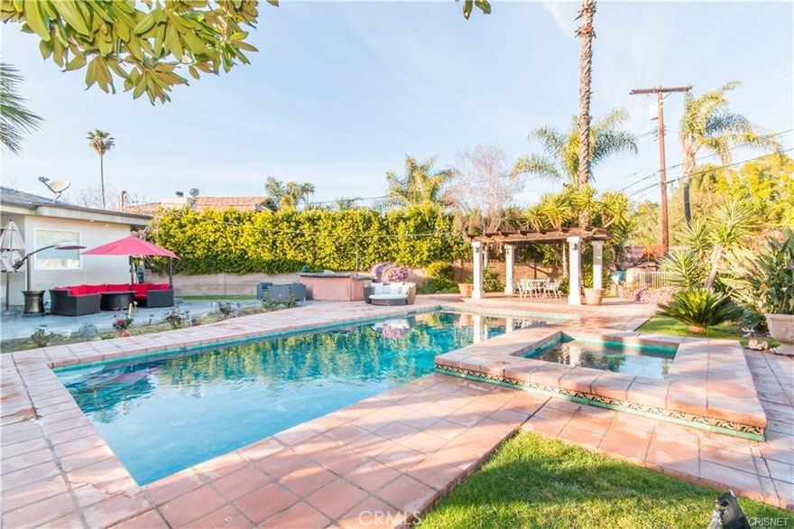 Welcome to this stunning light and bright newer construction home located in the highly sought after South of the Blvd Woodland Hills Community.  This home features a main house PLUS a huge new build detached guest house with an additional 2 bedrooms and 2 bathrooms. Set on huge private resort like grounds, this amazing property is a relaxing oasis perfect for family gatherings and making memories. Featuring all things luxury, this home has it all! Some of the wonderful amenities of this home incude: high ceilings, designer fixtures, high end Thermador appliances, open and spacious floor plan, living room with a wood burning fireplace, sparkling pool and jacuzzi, built in BBQ, and much much more.  Conveniently located next to The Village, Topanga Mall, the shops and restaurants of Ventura, parks, schools, and just a short ride to the beach.