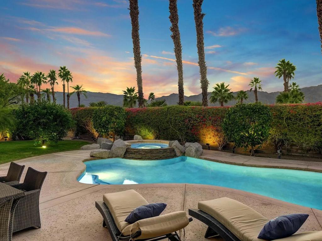 La Quinta Escape is as four bedroom, five bath,4000 sq/ft complete mountain-viewhome in the prestigious, elegant Painted Cove Community, La Quinta, CA. Golf at 25world class golf courses. Enjoy mountain hiking and fine dining. Each room has stunning, spectacular, unique original art from all over the world. The living room has apanoramic view of the Santa Ana Mountains. The four spacious bedrooms (each with its own bathroom) provide elegant. The grand master and second bedroom suites have stunning mountain views. An inviting fireplace; private garage; 4 TVS; BBQ; andoffice-are all for the upper bracket traveler. The gourmet kitchen provides an unmatched culinary experience. The FOUR eating areas have stunning mountain and pool views. Bike to charming Old La Quinta! Eat at 5 star restaurants! Book now!!Rates: December through April: $15,000.May through November: $9000.