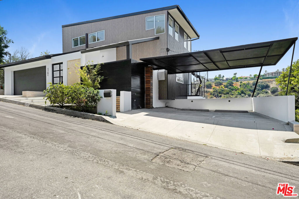 This newly remodeled 2021 contemporary entertainer's home with romantic views from every room and private roof top deck is set on one of Sherman Oaks' most desirable streets. Boasting approximately 400 feet of street frontage, the property offers ultimate privacy and a true estate-like feel rarely found in the area. This tri-level home designed for both elegance and functionality offers approximately 3981 sq. ft. of luxurious living with 4 bedrooms and 5 bathrooms. Thoughtfully , the main level features an open floor plan with high ceilings and large windows and glass doors for ultimate views. The main living area features open floor plan with living, dining and modern kitchen all with amazing views and handsome engineered white oak floors. The second floor features the master suite with private rooftop deck and modern bathroom, oval bathtub, walk-in closets and dual sink custom-built vanity. The lower level offers two bedrooms suites with high ceilings and balconies and library with floor to ceiling bookshelves. The home also offers a separate lower level with home gym, entertaining room / for loud music/dark room/men's cave. Outdoor activities include hiking trails of Sherman Oaks with amazing scenery. Enjoy the Sherman Oaks lifestyle!