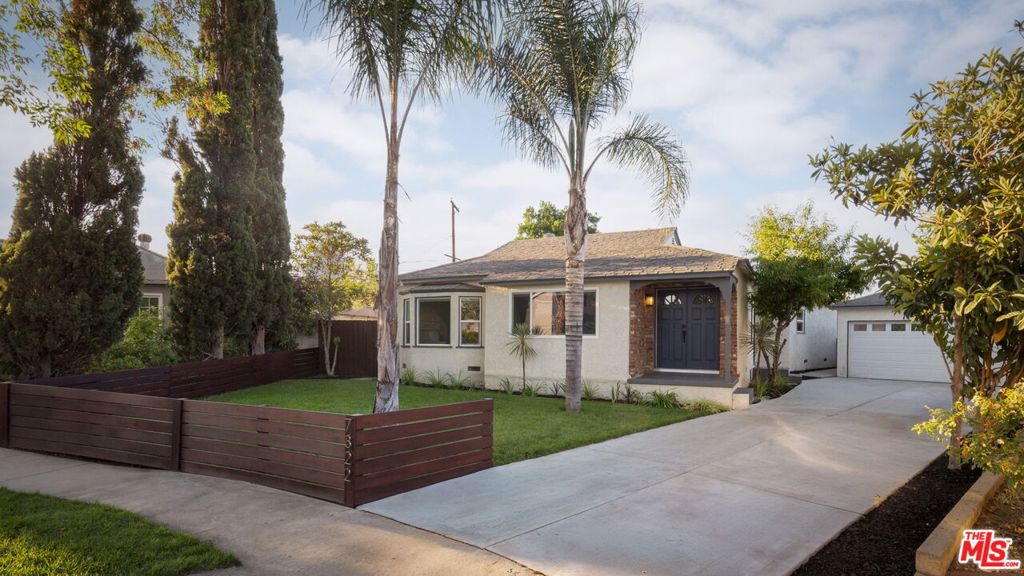Positioned on a quiet cul-de-sac, this fully updated home offers turnkey comfort with built-in potential for added value located in Chisholm Estates adjacent. This turnkey 3-bedroom, 2-bath residence has been thoughtfully updated throughout and offers the perfect blend of comfort, style, and long-term potential. Inside, the open-concept layout is filled with natural light and features wide-plank flooring, recessed lighting, and a beautifully designed kitchen complete with a large waterfall island, quartz countertops, custom cabinetry, and stainless-steel appliances. The spacious primary suite includes a cozy sitting area, large closet space, and a spa-inspired bathroom with an oversized walk-in shower. Step outside to a private backyard designed for both entertaining and everyday enjoyment. Multiple patio zones, two grassy lawn areas, and mature trees provide a tranquil and versatile setting - with no rear neighbors for added privacy. Whether hosting friends or enjoying a quiet evening, this outdoor space offers room to relax, play, or expand. The detached garage is a major bonus - perfectly positioned for an ADU conversion. Additional features include: brand-new driveway with drive-through garage access, parking for 6+ vehicles, tankless water heater, central HVAC, and an indoor laundry room. Conveniently located near the 405 freeway, Van Nuys Airport, shopping centers, local schools, and parks, this home checks every box for modern Valley living with future upside.