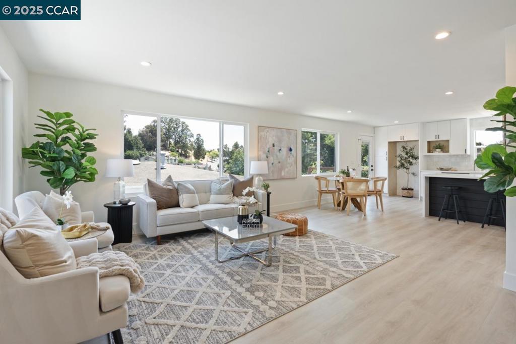 Welcome to 1923 Thompson Ln., a newly renovated single-family home in El Sobrante. This 2-bedroom, 1-bath home offers comfortable living with an easy-flowing floor plan, showcasing thoughtful updates throughout. New viny flooring throughout and large, large dual-pane windows create an inviting and light-filled living space. The brand-new kitchen features stainless steel appliances, new cabinetry, countertops, and a separate eating area with a breakfast bar. The fully updated bathroom includes new fixtures, hardware, vanity, tile, and tub. Additional upgrades include freshly painted interior and exterior, a new HVAC system, and a Compliance Certified Private Sewer Lateral. The home sits on a spacious, fenced lot, offering a tranquil space perfect for outdoor dining and relaxation. A bonus exterior half bath, conveniently located near the garage, adds functionality for gardening days, outdoor hosting, or potential expansion. An attached garage provides ample storage and parking options. Conveniently located near freeways, BART, the San Pablo Reservoir, and Kennedy Grove Regional Park, this home is an opportunity you won’t want to miss.
