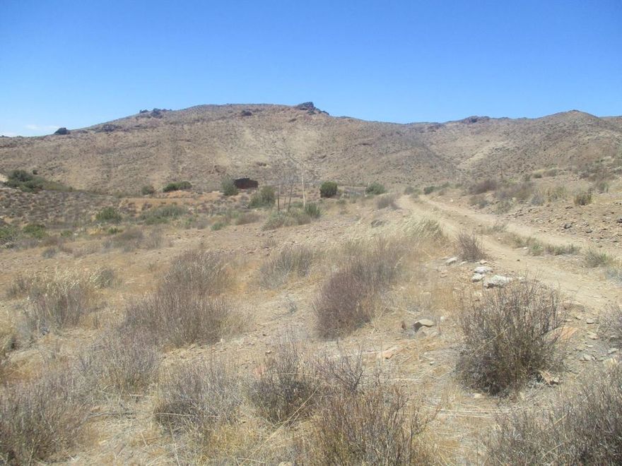 Seller may carry financing! 20+ Acres in Hughs Canyon with road access, set on the western foothills of Parker Mtn. High priced homes in the area. The ultimate private setting, like your own canyon with practically no neighbors. Only 12 minutes to amenities in downtown Acton. Perched on a hillside, where there appears to be a buildable area of about 15,000 sqft on a ridge that meets the road. Beautiful vistas of mountain peaks and rock formations. Horse property. Starry nights. Perfect for your dream compound and secret hideaway. No utilities so go with solar, propane, and a well. Zoned Agricultural which allows for many additional uses. Inside the Hollywood Studio Zone. Great for a custom built house or manufactured home. With high real estate prices it's a great time to build and develop land. 39 minutes to Santa Clarita. 28 minutes to Palmdale.56 minutes to Los Angeles. For all questions on building and uses contact the county planning department. For all questions on utilities contact the appropriate agencies. Address is in MLS is not an assigned address and is for marketing purposes only. APN: 3209-005-028 GPS: 34.460634, -118.234287 Don't Wait! - Call Now!